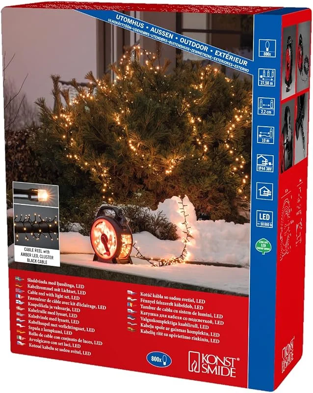 Besuche den Konstsmide-Store Konstsmide Micro LED Compactlights Lichterkette mit Kabelaufroller, schwarz-rot, 800 bernsteinfarbene Dioden, 30V Außentrafo, 6W, schwarzes Kabel - 3848-800 — Weihnachtsbeleuchtung